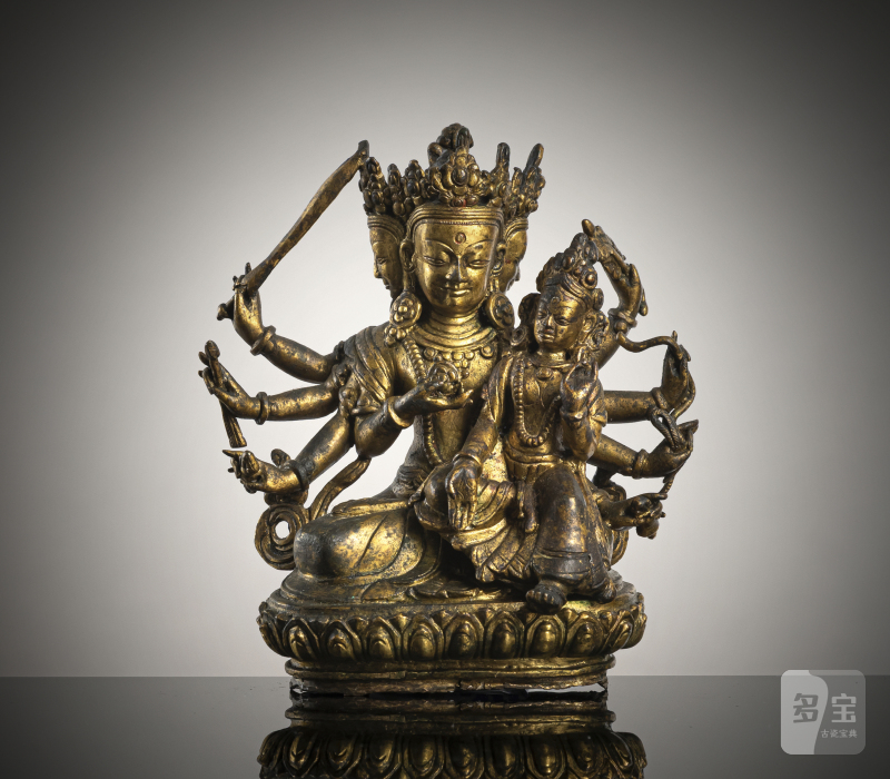 A GILT-BRONZE FIGURE OF MANJUGOSHA AND CONSORT
